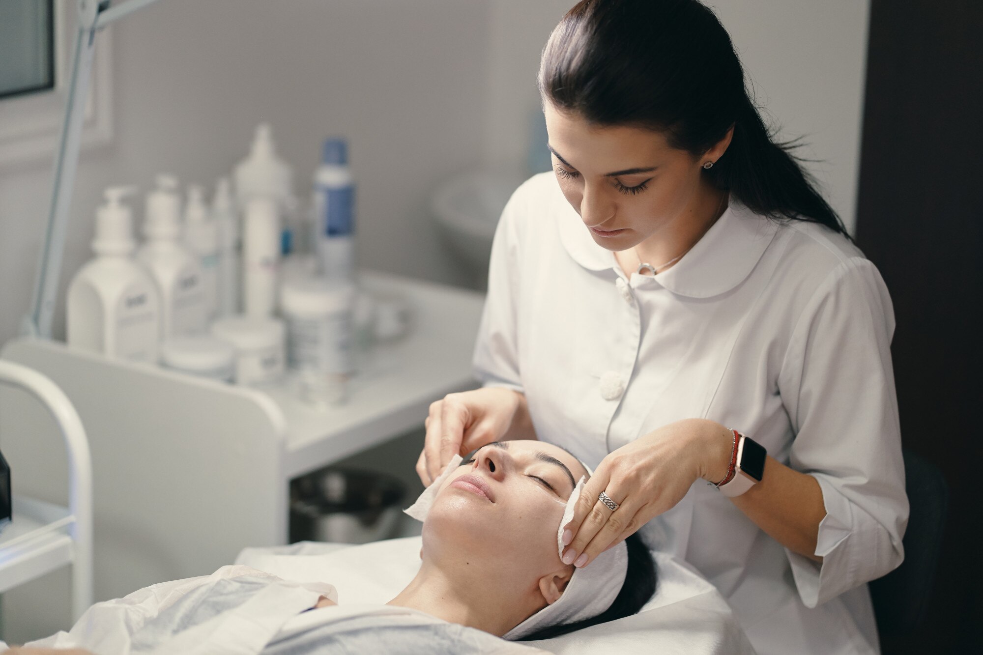 female cosmetologist making facial treatment beautiful woma 158595 4587